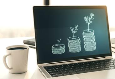 Illustrations of plants and coins growing on a computer screen